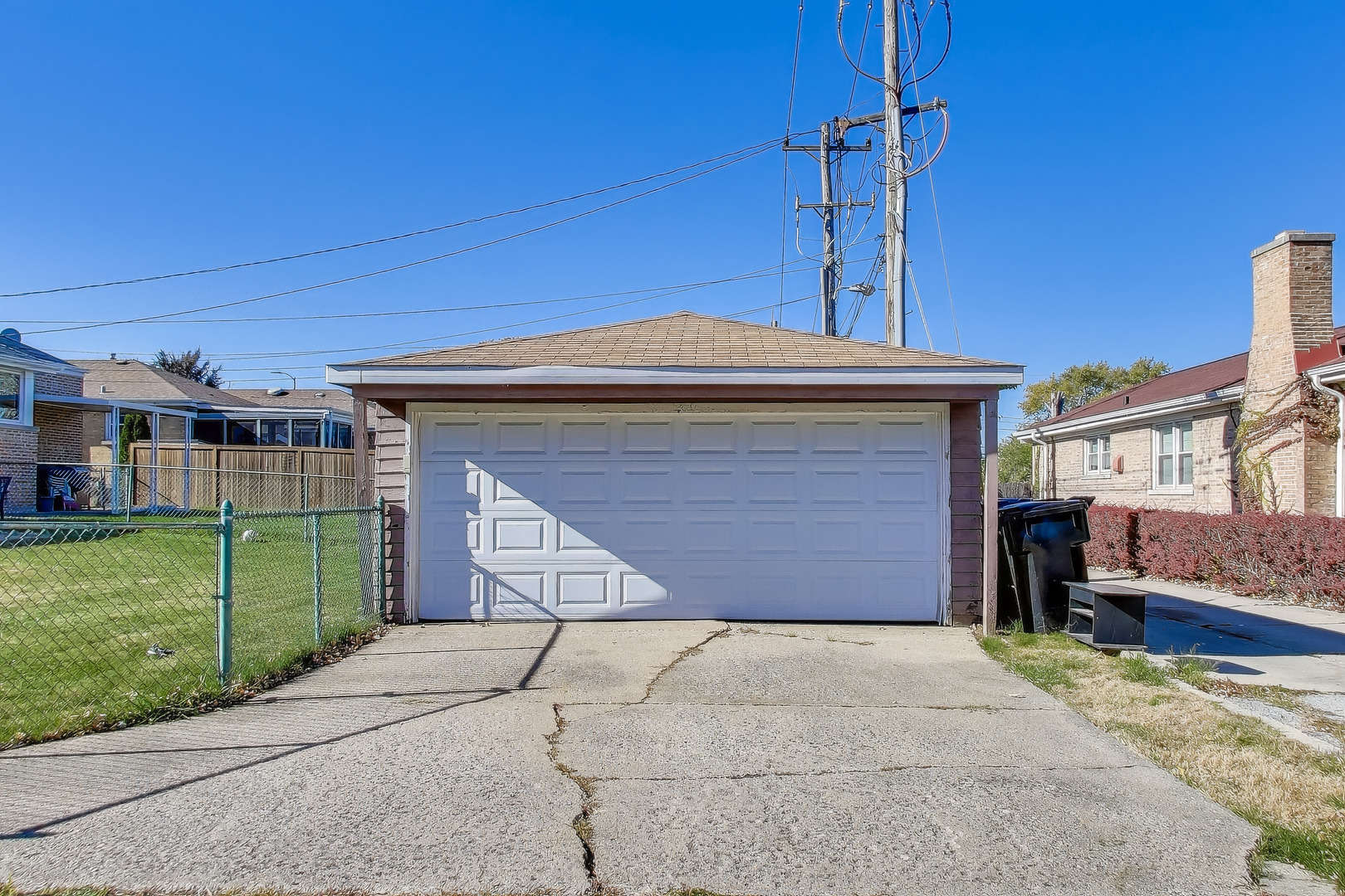 Undisclosed Address Chicago, IL 60655 - Photo 21 of 25 a front view of a house with a yard and garage