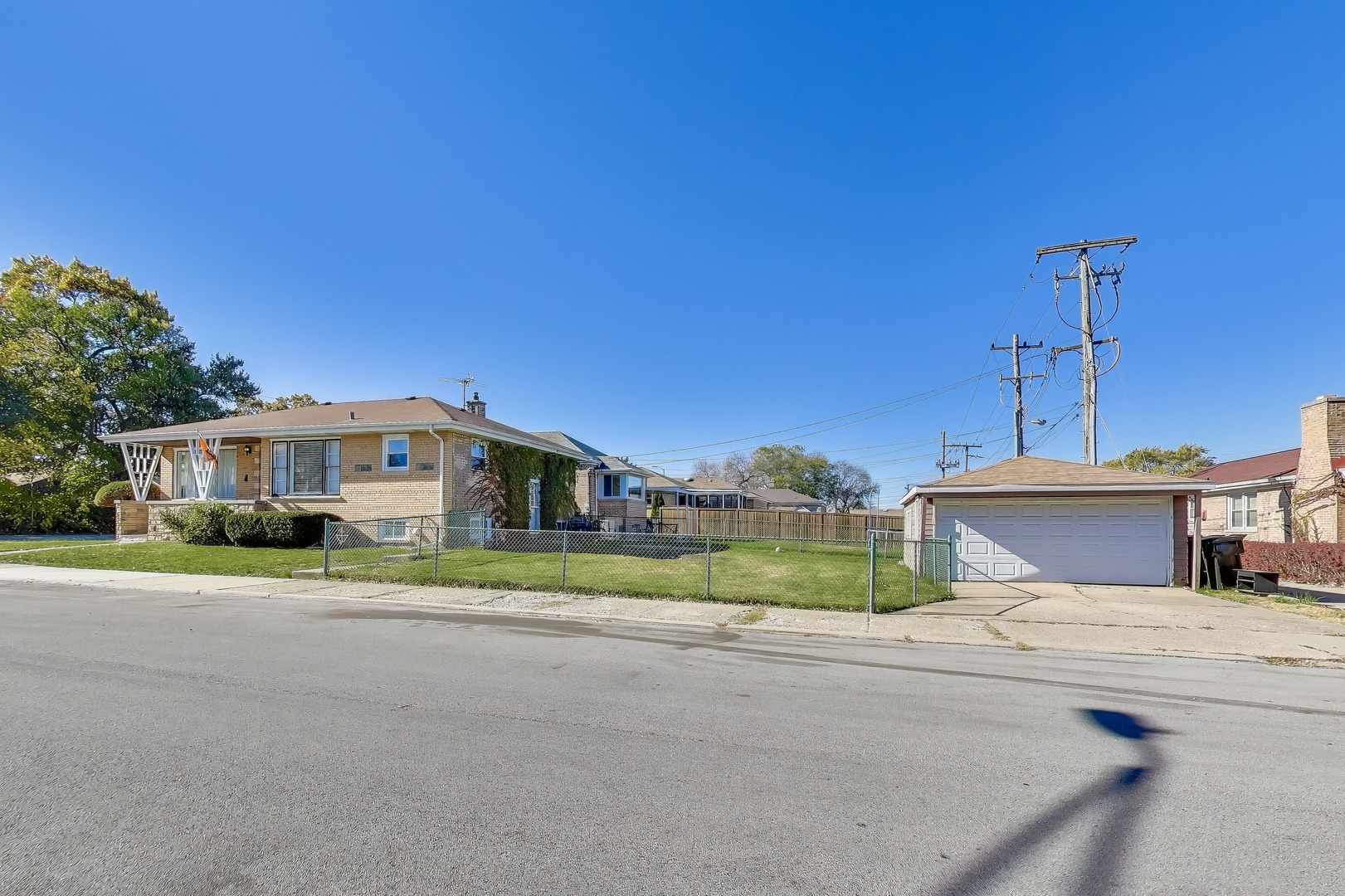 Undisclosed Address Chicago, IL 60655 - Photo 23 of 25 a front view of a house with a yard and potted plants