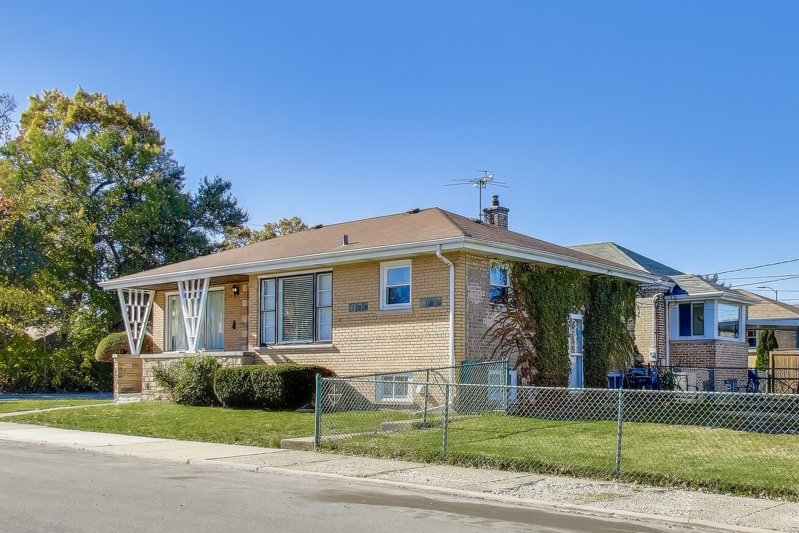 Undisclosed Address Chicago, IL 60655 - Photo 4 of 25 a front view of a house with a yard