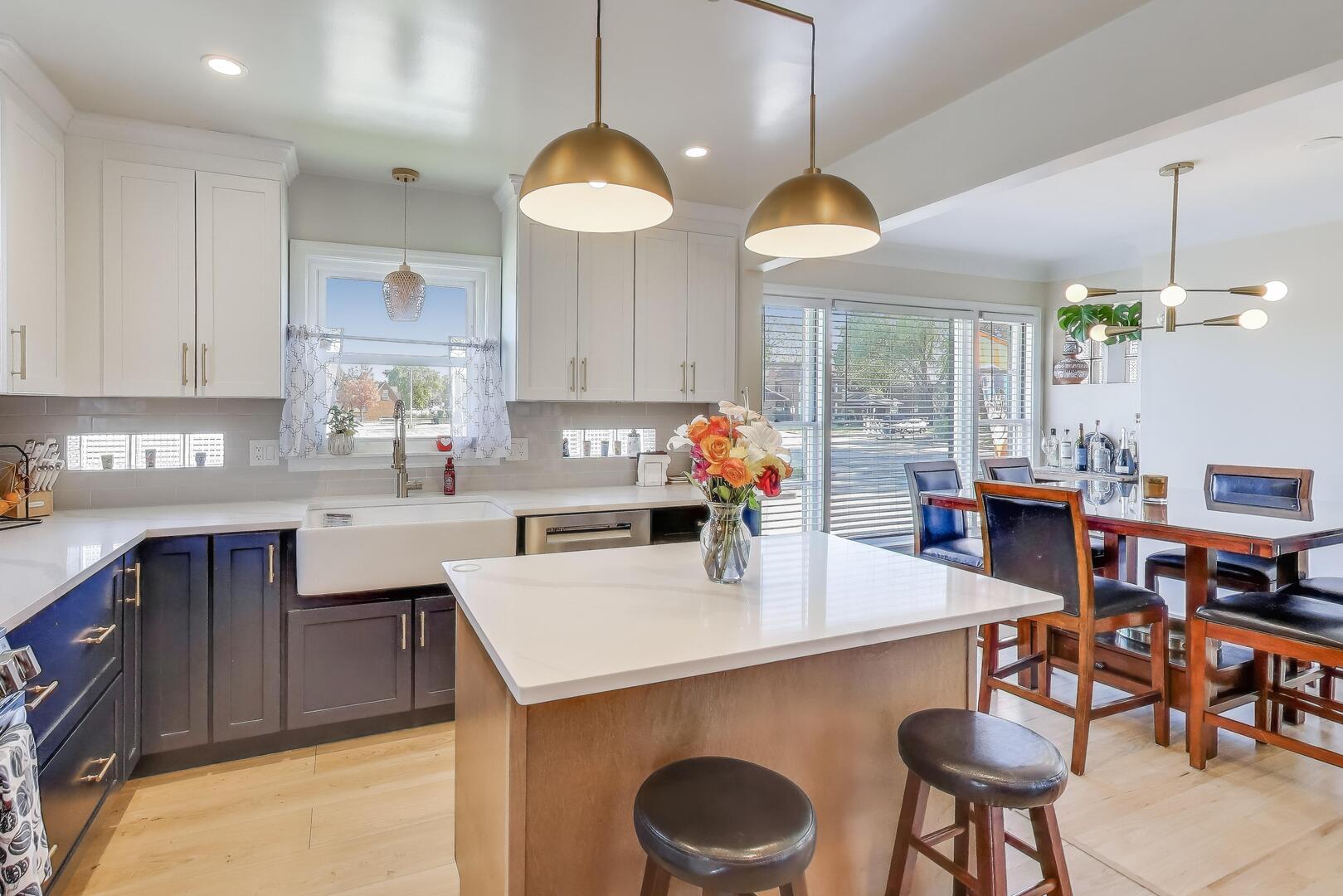 Undisclosed Address Chicago, IL 60655 - Photo 5 of 25 a kitchen with a dining table chairs and white cabinets