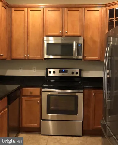 a kitchen with a stove and a microwave