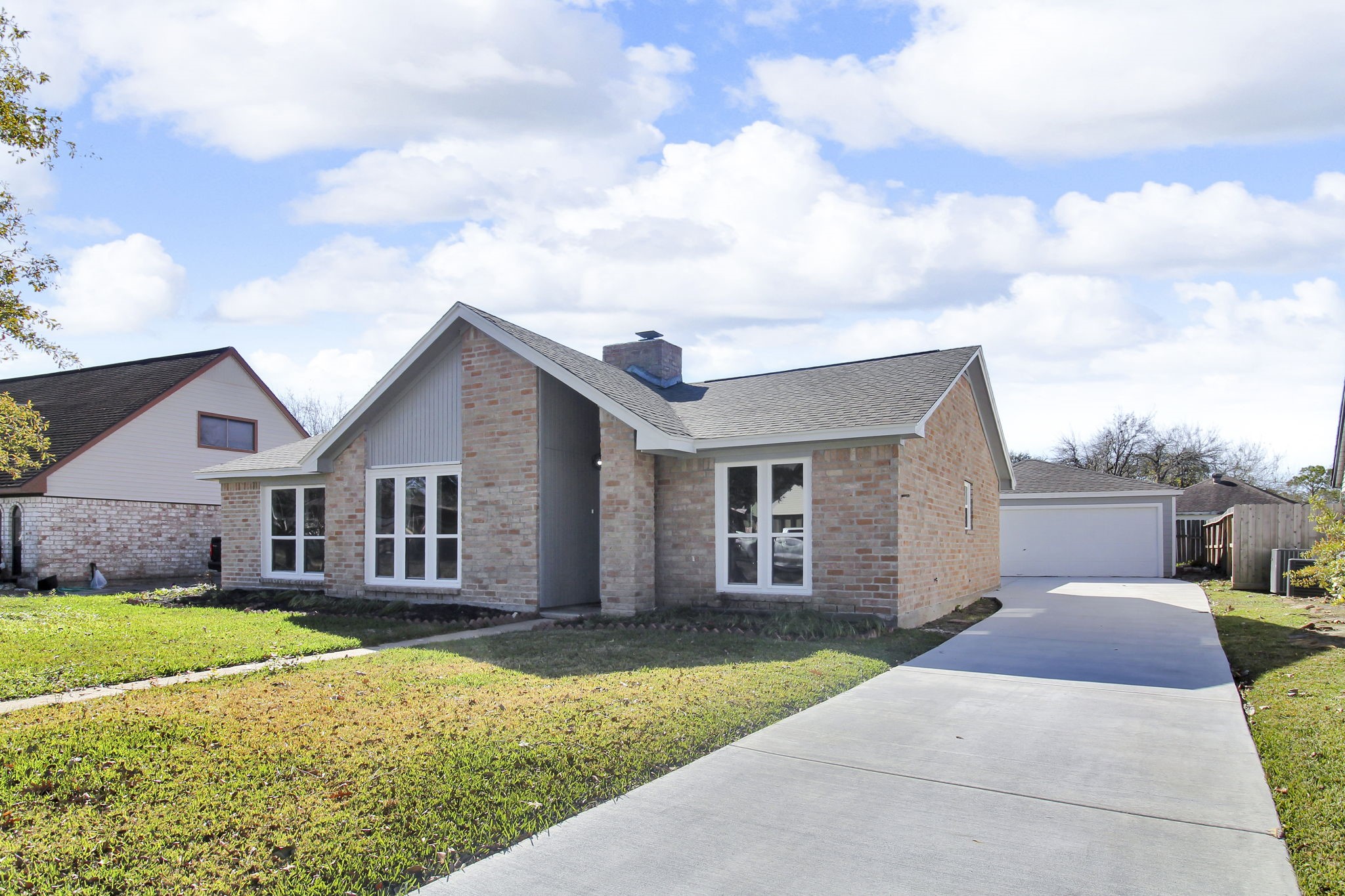 front view of a house with a yard