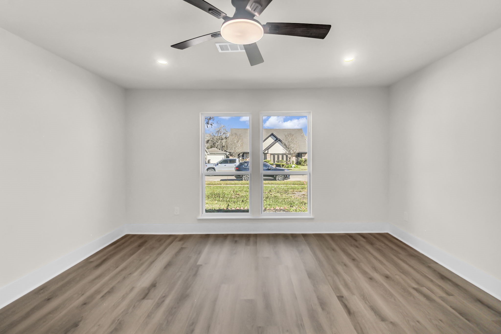 11630 Sagewillow Lane Houston, TX 77089 - Photo 14 of 25 wooden floor in an empty room with a window