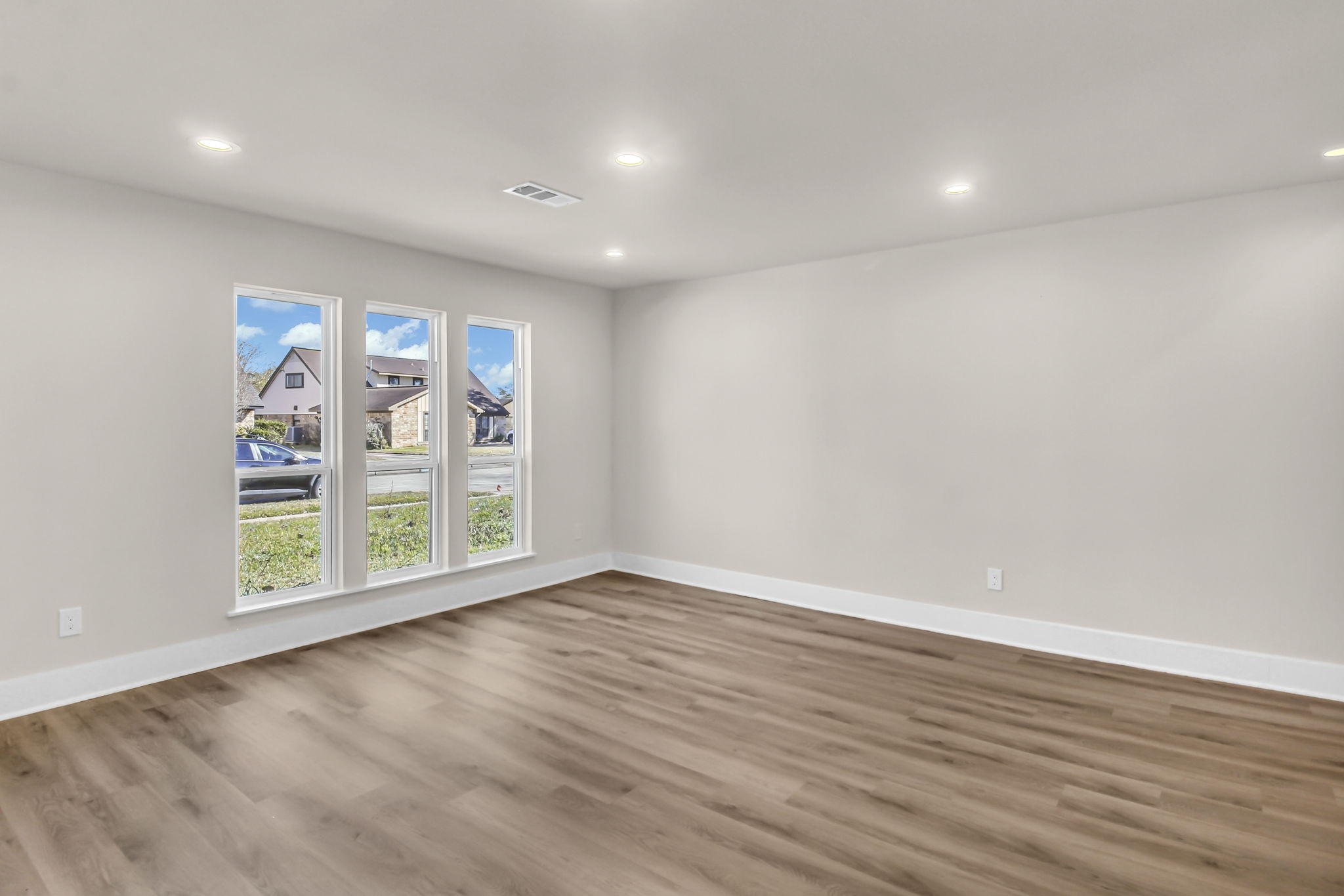 11630 Sagewillow Lane Houston, TX 77089 - Photo 5 of 25 wooden floor in an empty room with a window