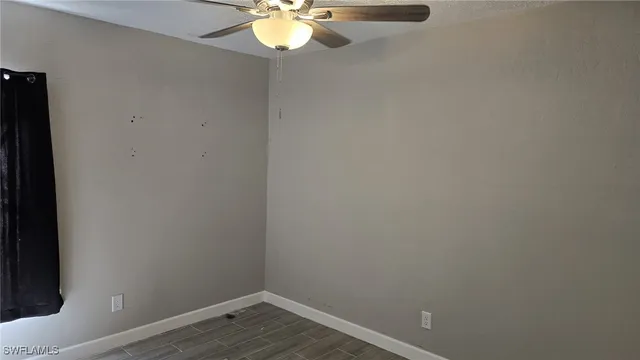 a view of a small space with wooden floor