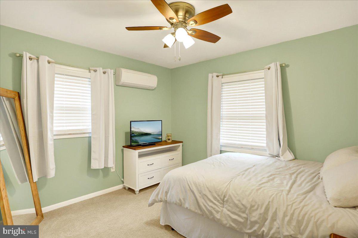 919 Philadelphia Avenue Reading, PA 19607 - Photo 29 of 37 a bedroom with a bed and a chandelier