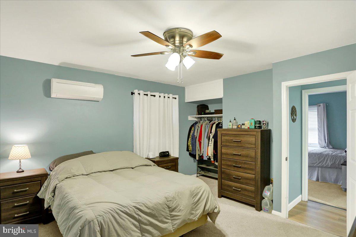 919 Philadelphia Avenue Reading, PA 19607 - Photo 32 of 37 a bedroom with bed and a chandelier