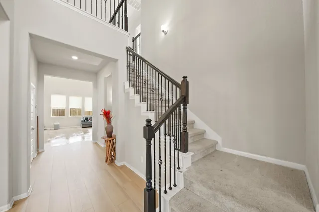 a view of a hallway view with staircase