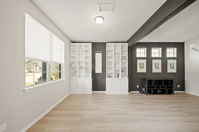 a front view of a house with a large window