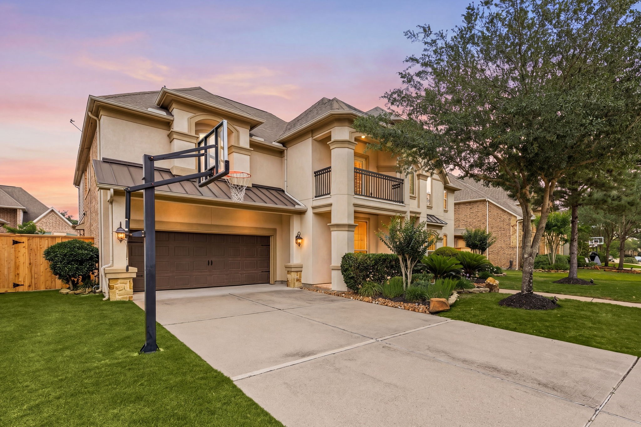 3306 Reston Landing Lane Katy, TX 77494 - Photo 2 of 50 This Mediterranean-style home with exceptional curb appeal, featuring an oversized driveway, 3-car garage, charming Juliet balcony, and lush, beautifully manicured landscaping.