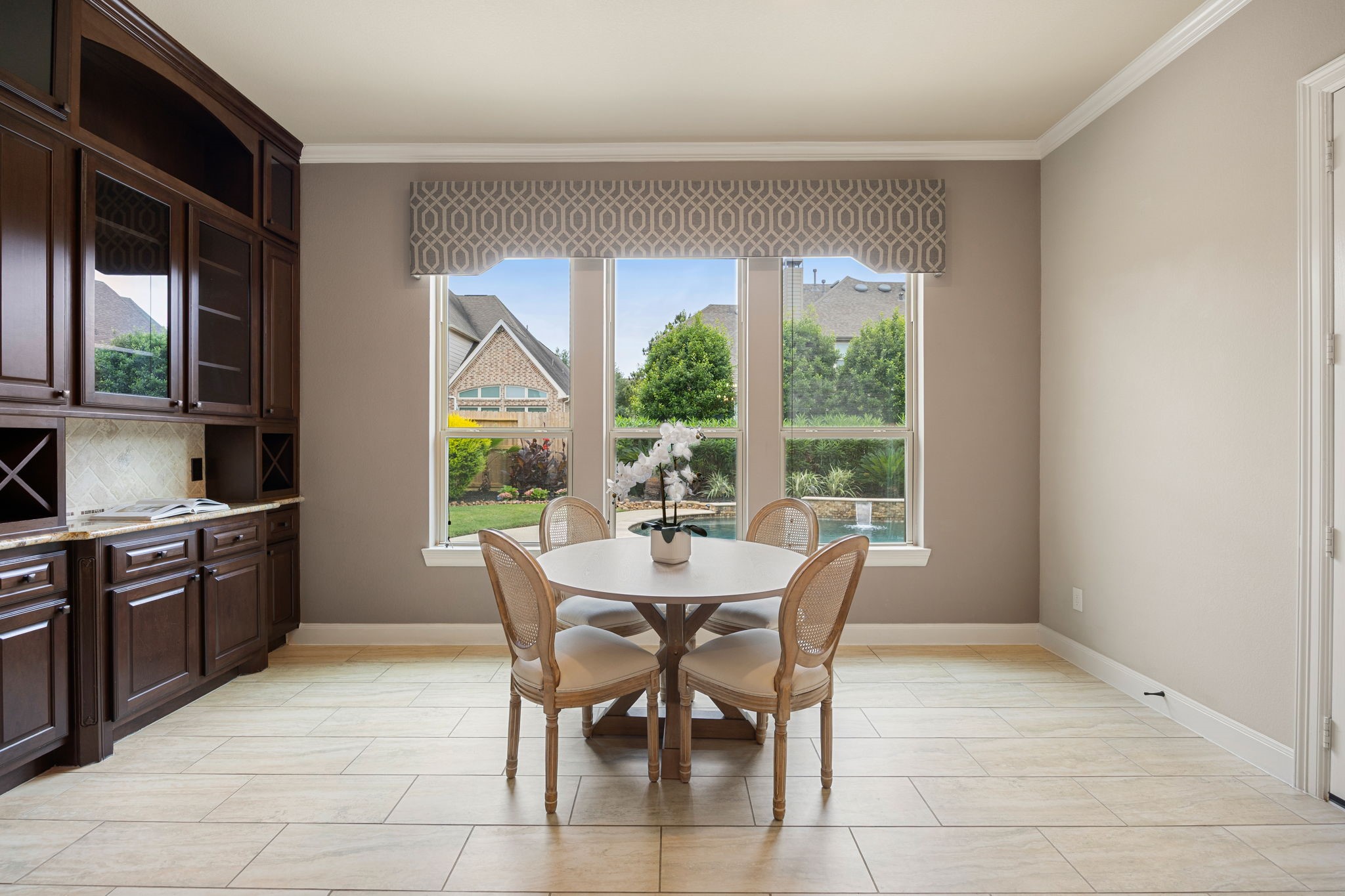 3306 Reston Landing Lane Katy, TX 77494 - Photo 21 of 50 The light-filled breakfast nook offers optimal backyard views, complete with built-in cabinetry for added storage and displays.