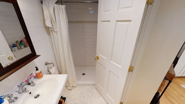 a bathroom with a bathtub and sink