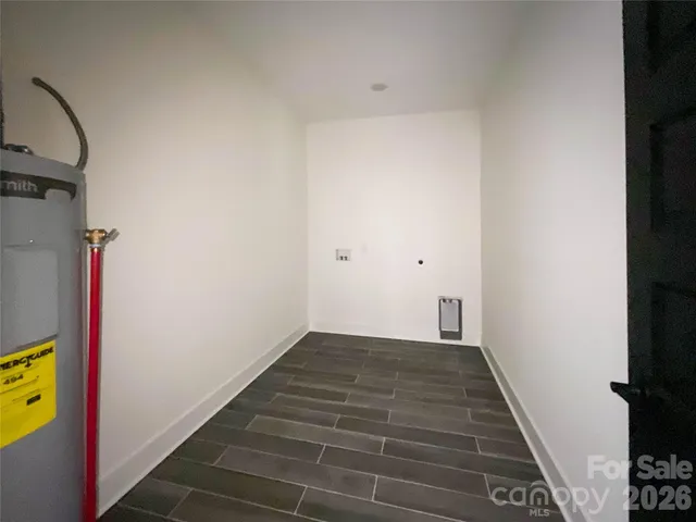 a view of a hallway with wooden floor and a hallway
