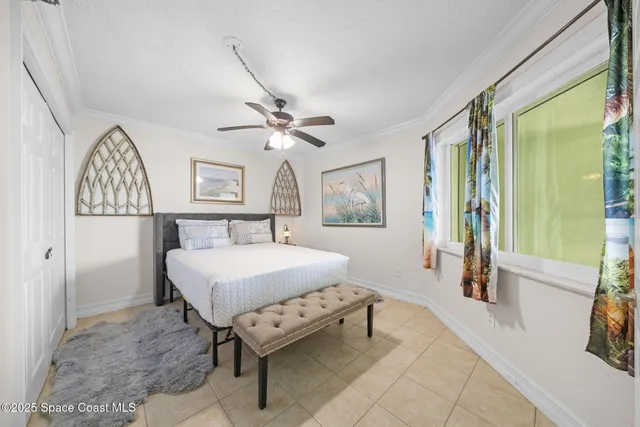 a living room with a bed furniture and a window