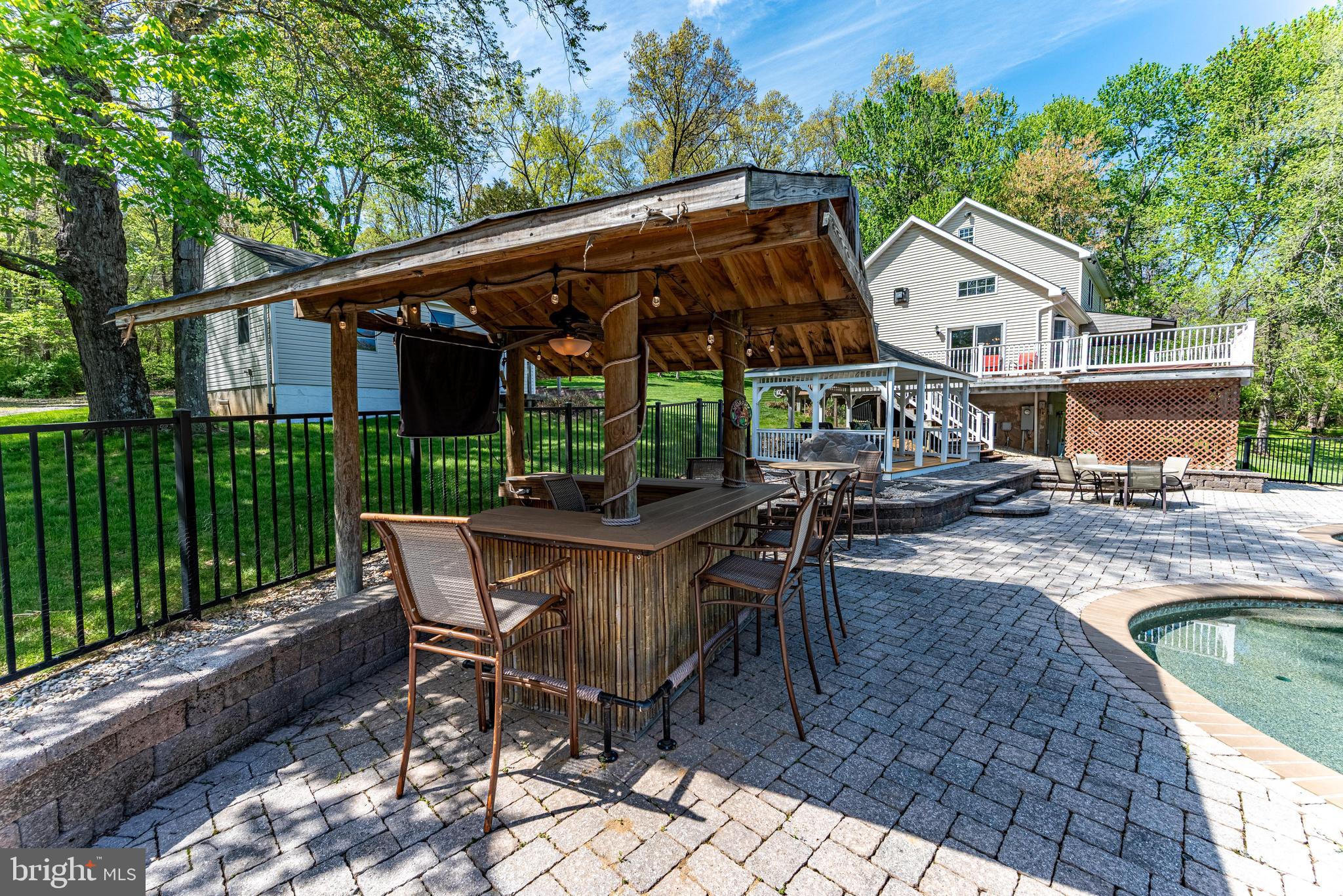 20413 Gore Mill Road Freeland, MD 21053 - Photo 22 of 35 a view of backyard with deck and outdoor seating