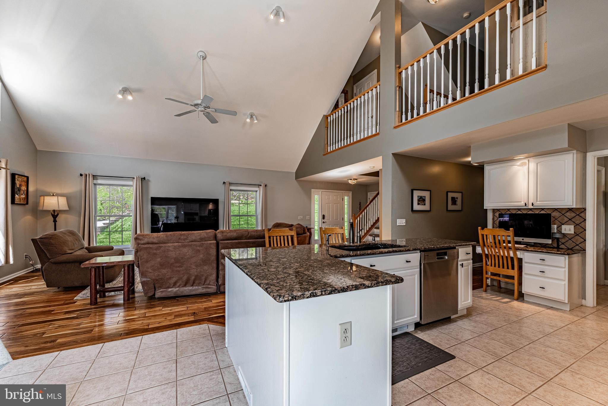 20413 Gore Mill Road Freeland, MD 21053 - Photo 8 of 35 a kitchen with stainless steel appliances granite countertop a sink a stove top oven a counter space and cabinets
