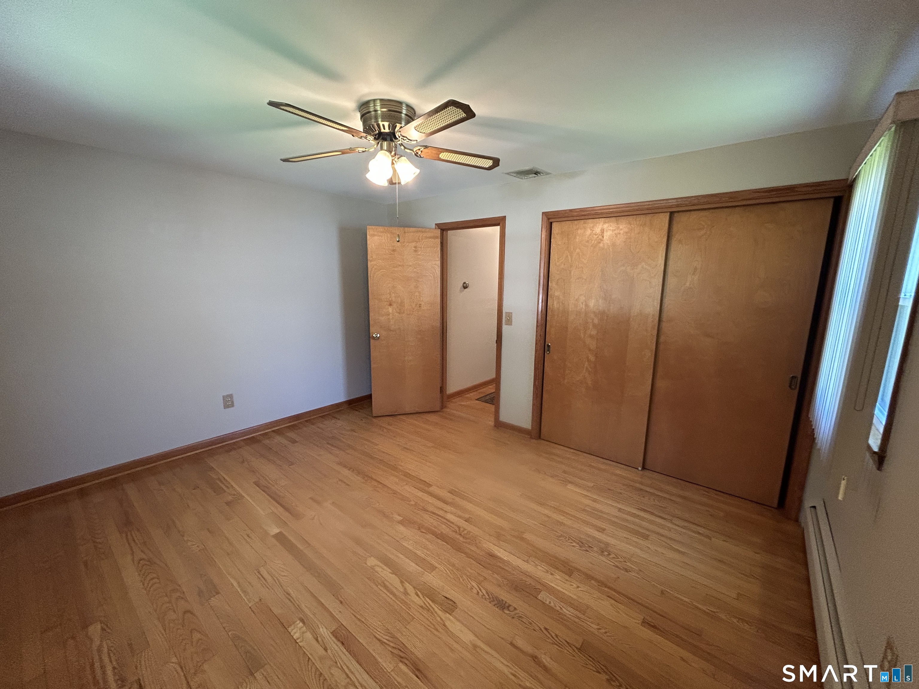 13 Walnut Lane Wallingford, CT 06492 - Photo 14 of 27 a view of an empty room with a window