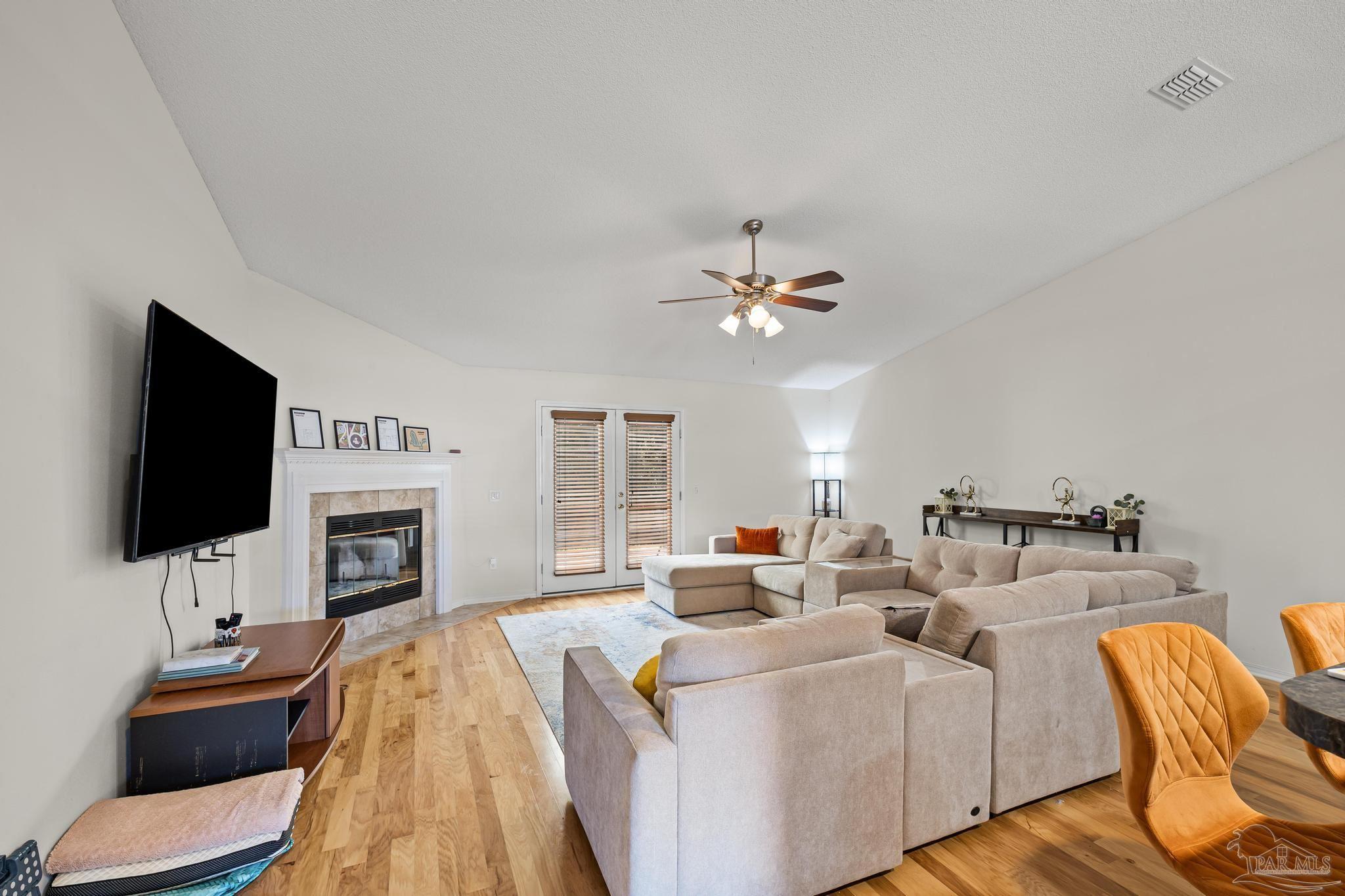 2165 Liberty Loop Road Cantonment, FL 32533 - Photo 15 of 51 a living room with furniture and a flat screen tv