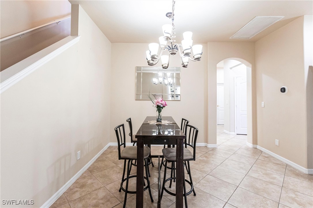 2808 Via Piazza Loop Fort Myers, FL 33905 - Photo 11 of 49 a view of a dining room with furniture and chandelier