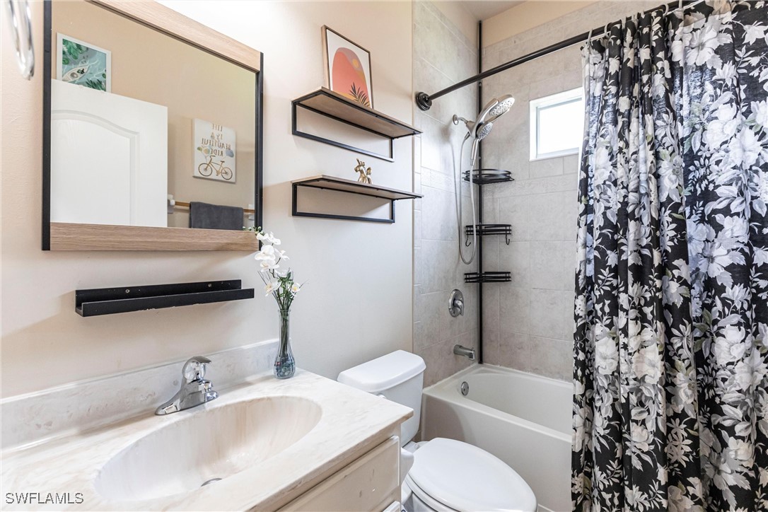 2808 Via Piazza Loop Fort Myers, FL 33905 - Photo 22 of 49 a bathroom with a sink toilet and shower