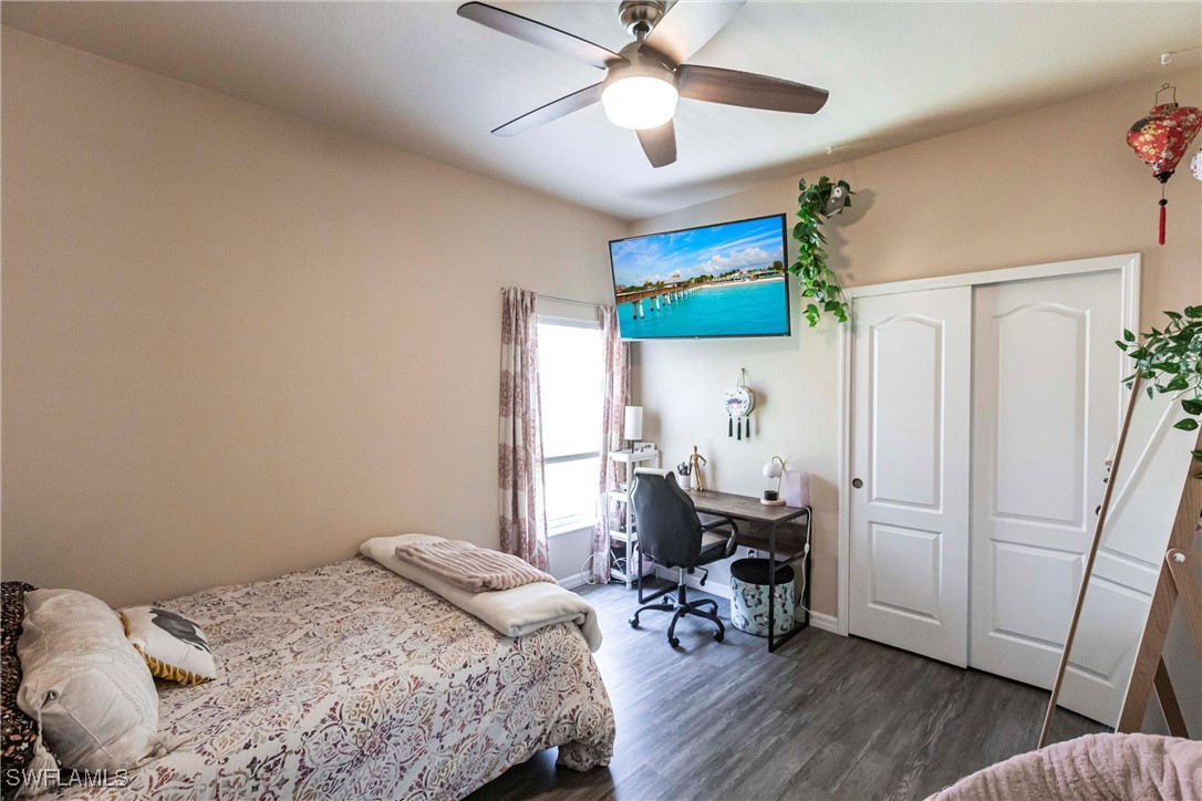 2808 Via Piazza Loop Fort Myers, FL 33905 - Photo 23 of 49 a bedroom with a bed and a table