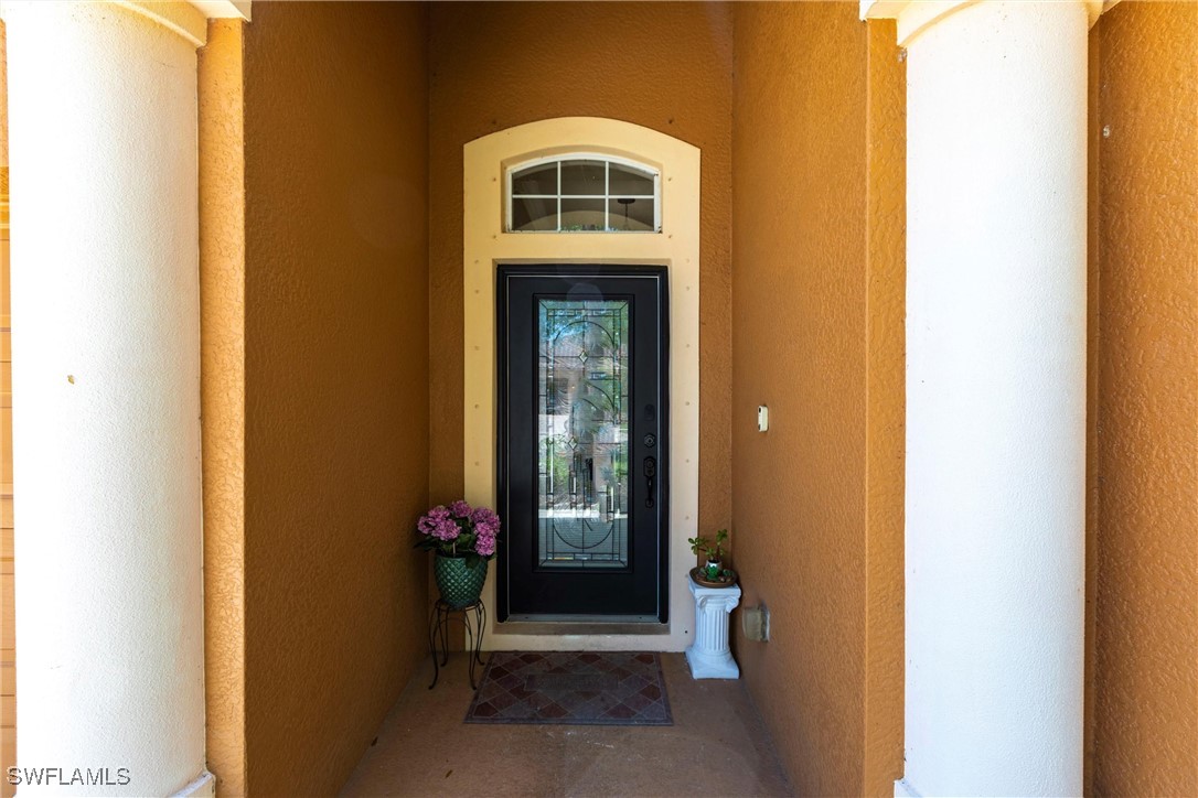 2808 Via Piazza Loop Fort Myers, FL 33905 - Photo 3 of 49 a front door view of a house with a entryway