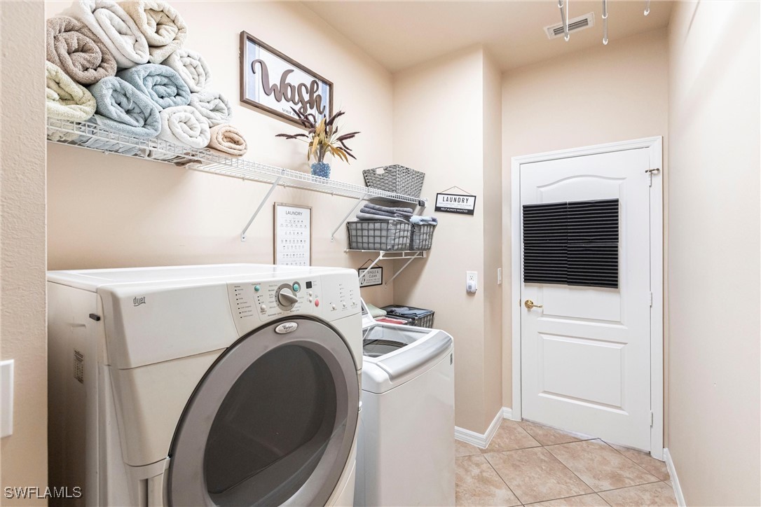 2808 Via Piazza Loop Fort Myers, FL 33905 - Photo 34 of 49 a utility room with dryer and washer