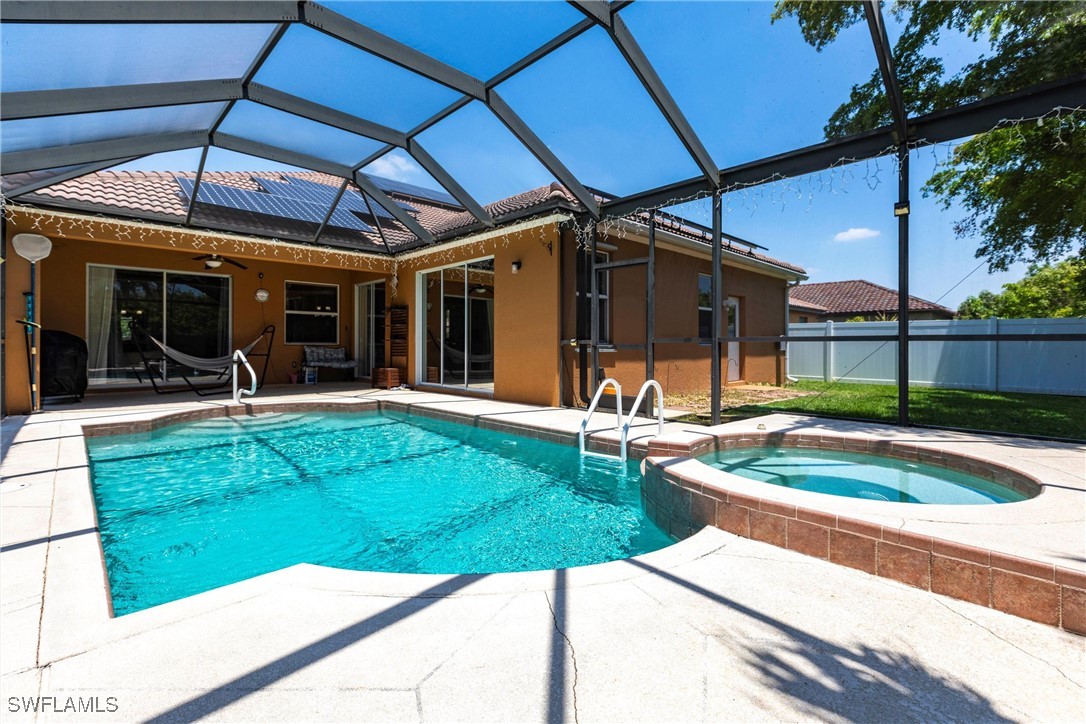 2808 Via Piazza Loop Fort Myers, FL 33905 - Photo 40 of 49 a view of a house with backyard porch and sitting area