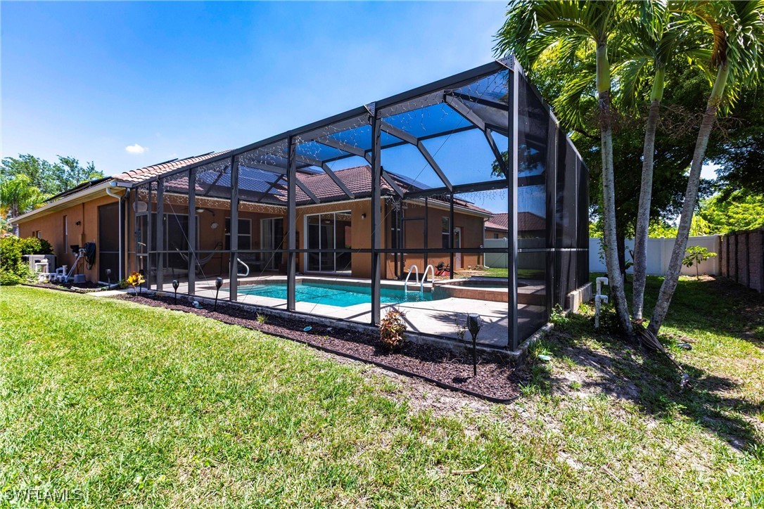 2808 Via Piazza Loop Fort Myers, FL 33905 - Photo 42 of 49 a view of a house with backyard and sitting area