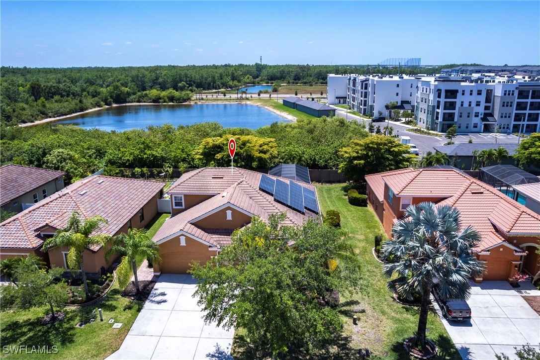 2808 Via Piazza Loop Fort Myers, FL 33905 - Photo 44 of 49 an aerial view of multiple houses with yard
