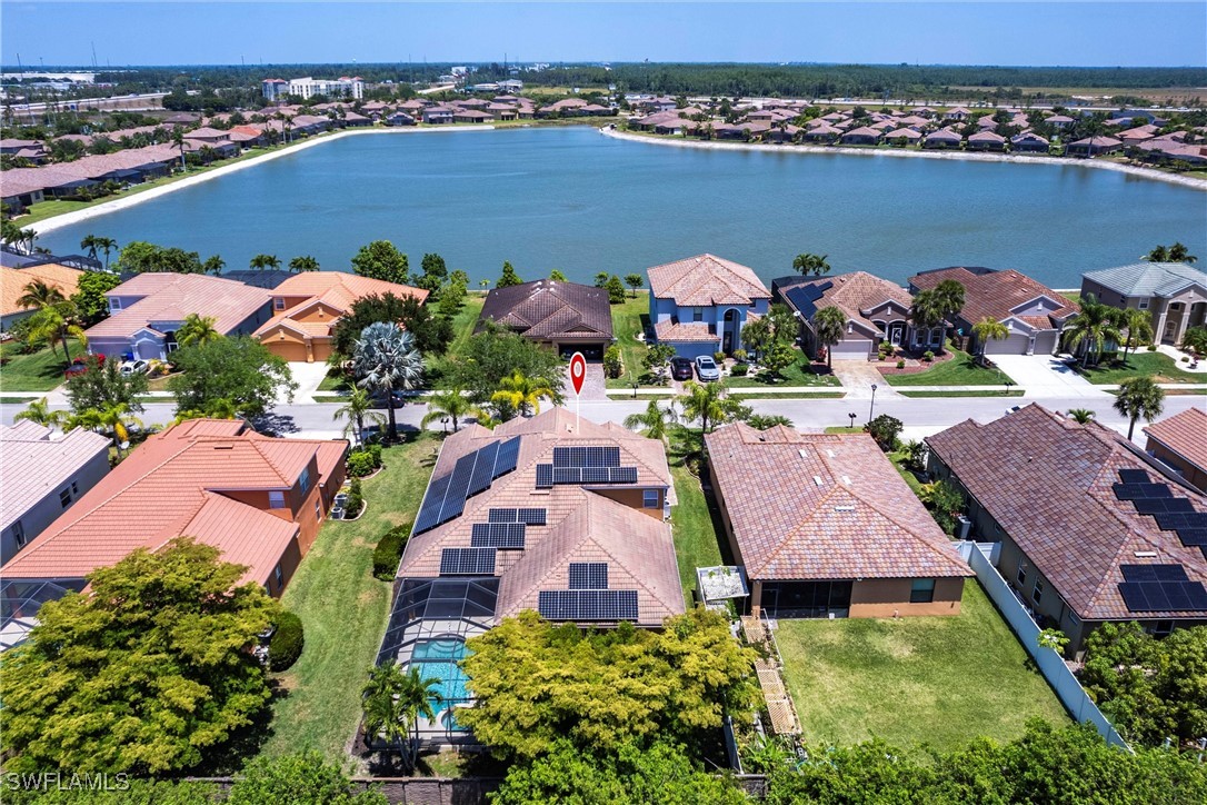 2808 Via Piazza Loop Fort Myers, FL 33905 - Photo 45 of 49 an aerial view of house with yard space and ocean view