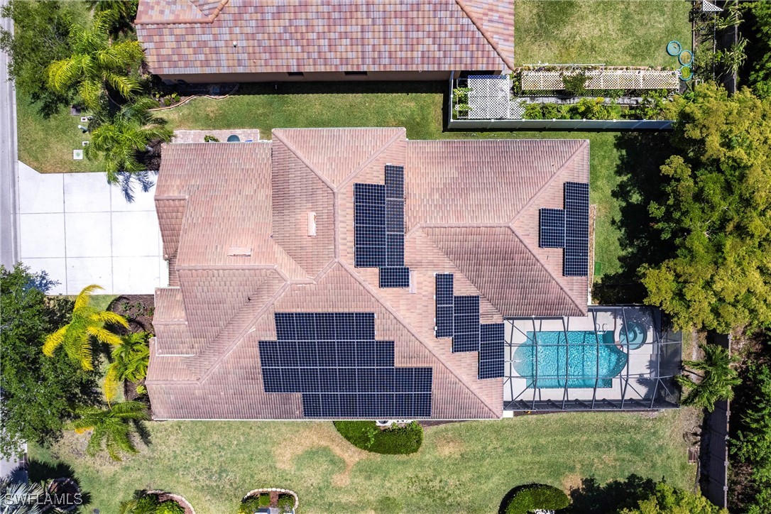 2808 Via Piazza Loop Fort Myers, FL 33905 - Photo 48 of 49 an aerial view of a house with a garden and plants