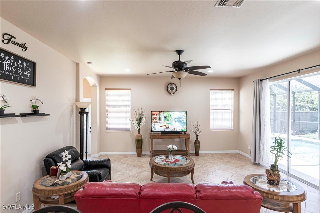 2808 Via Piazza Loop Fort Myers, FL 33905 - Photo 6 of 49 a living room with furniture and a large window