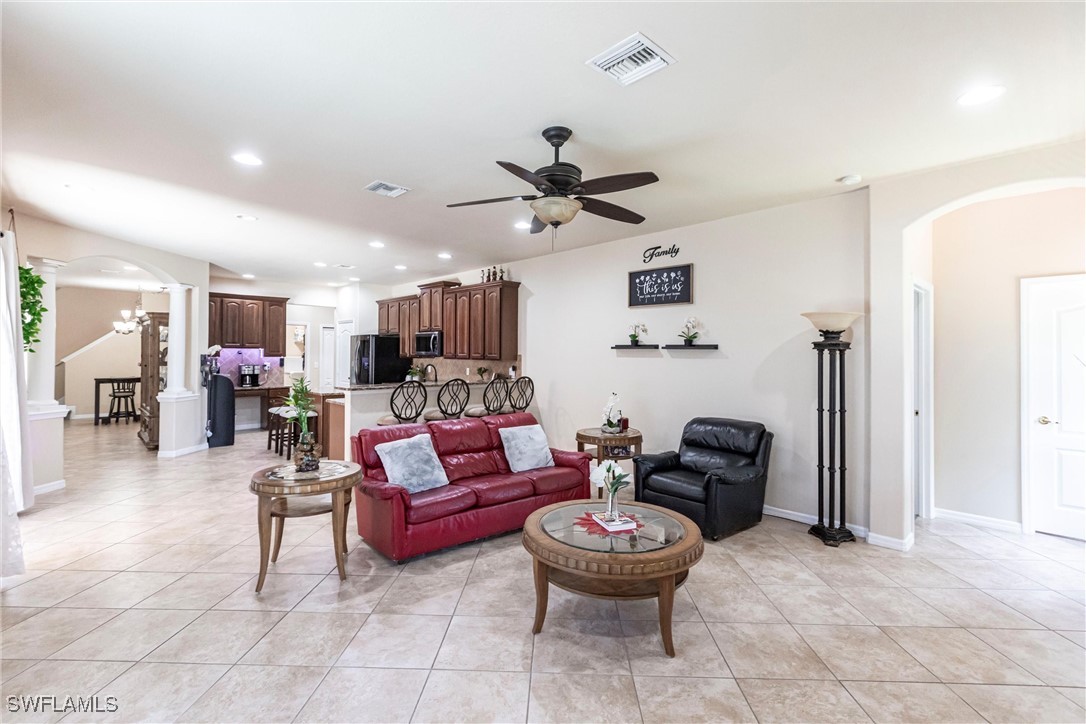 2808 Via Piazza Loop Fort Myers, FL 33905 - Photo 7 of 49 a living room with furniture and a view of kitchen