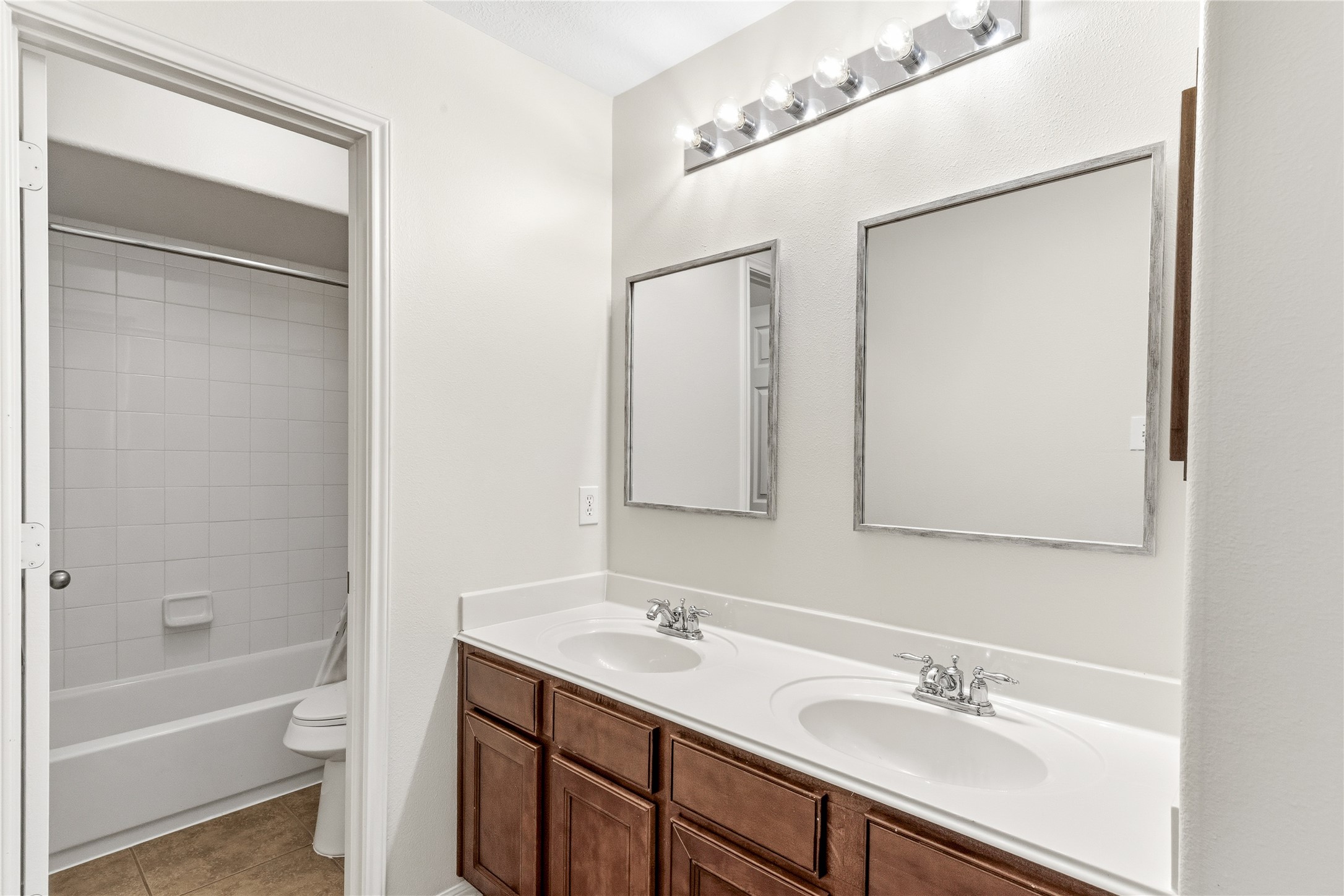 6211 Stone Hill Road Spring, TX 77389 - Photo 35 of 43 a bathroom with a sink a toilet and shower