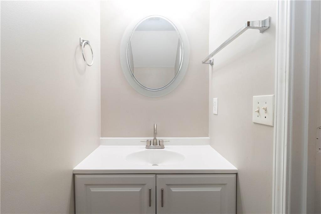745 Crestwell Circle Atlanta, GA 30331 - Photo 13 of 38 a bathroom with a sink and a mirror