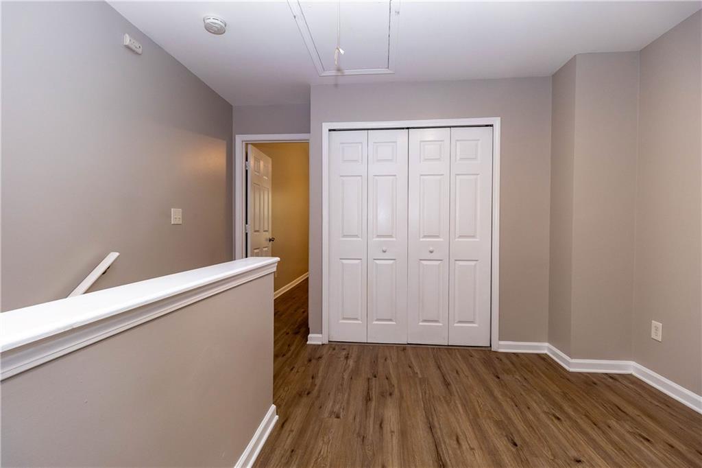745 Crestwell Circle Atlanta, GA 30331 - Photo 15 of 38 wooden floor in an empty room with a window
