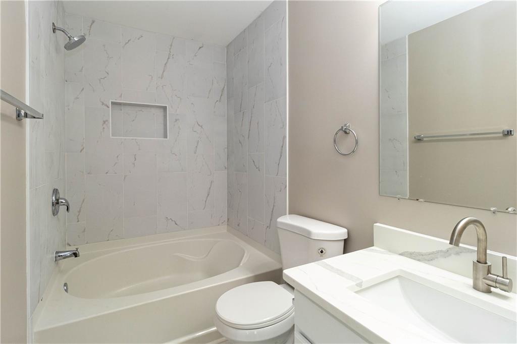 745 Crestwell Circle Atlanta, GA 30331 - Photo 20 of 38 a bathroom with a sink toilet and shower