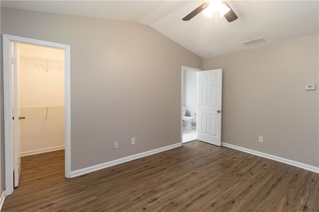 745 Crestwell Circle Atlanta, GA 30331 - Photo 22 of 38 an empty room with wooden floor and windows