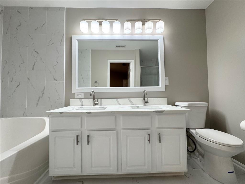 745 Crestwell Circle Atlanta, GA 30331 - Photo 27 of 38 a bathroom with a sink and a mirror