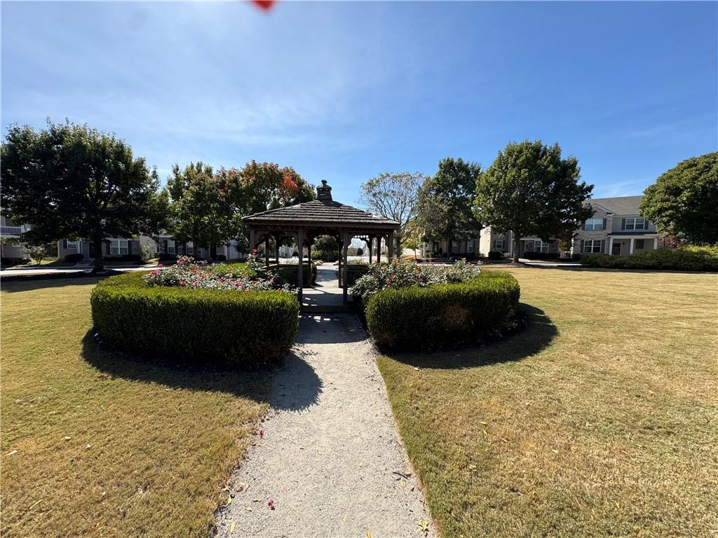 745 Crestwell Circle Atlanta, GA 30331 - Photo 38 of 38 a street view with couple of cars parked on road and trees in the background