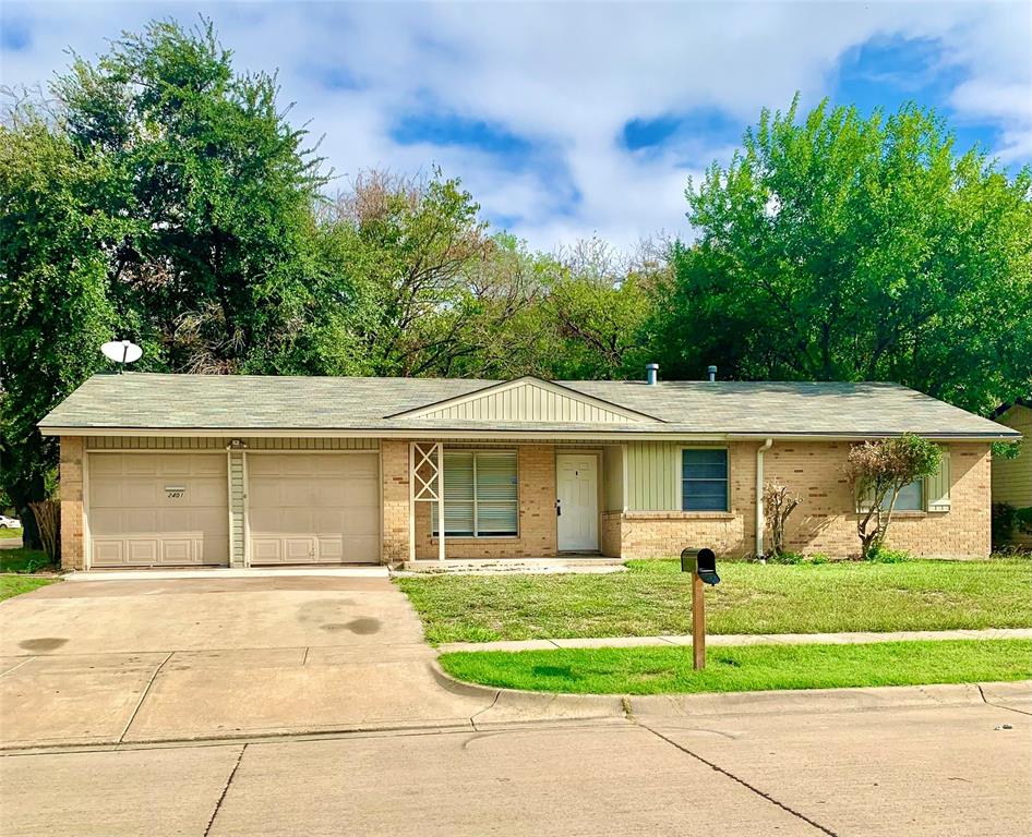 2401 Gilbert Circle Arlington, TX 76010 - Photo 1 of 1 a front view of a house with a yard