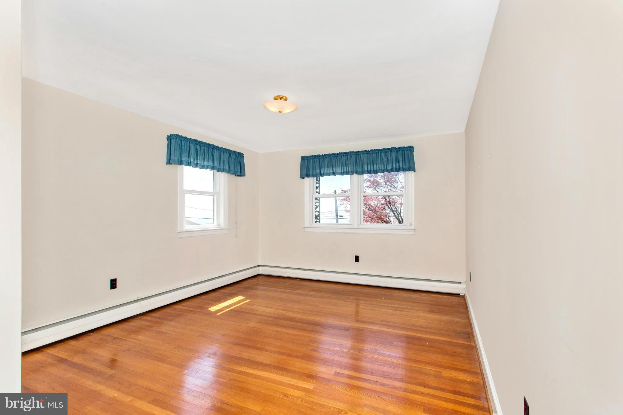 7417 Ridge Road Frederick, MD 21702 - Photo 22 of 30 a view of a room with wooden floor and window