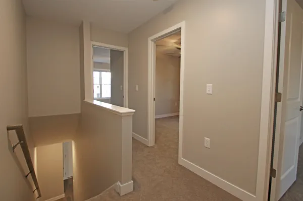 a view of an entryway with wooden floor