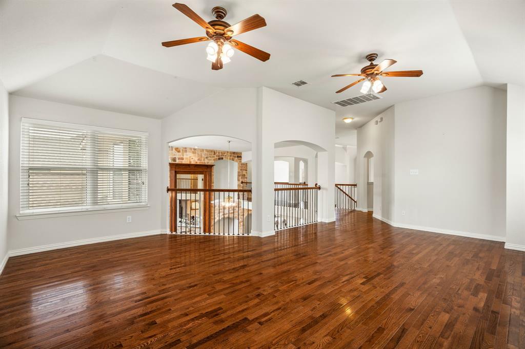 2012 Burnside Drive Allen, TX 75013 - Photo 31 of 40 a view of empty room with wooden floor and fan
