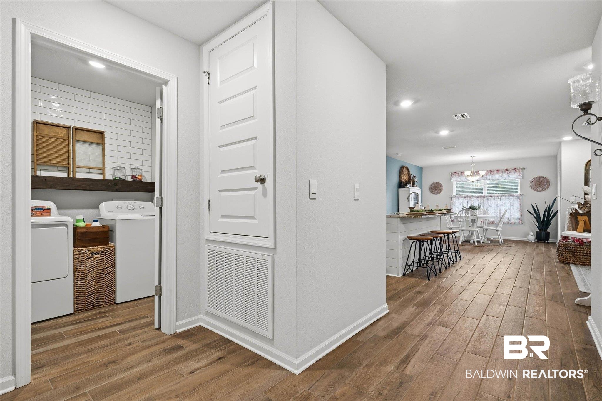 17041 Muse Street Loxley, AL 36551 - Photo 17 of 44 Hall featuring wood finished floors, washer and clothes dryer, and recessed lighting