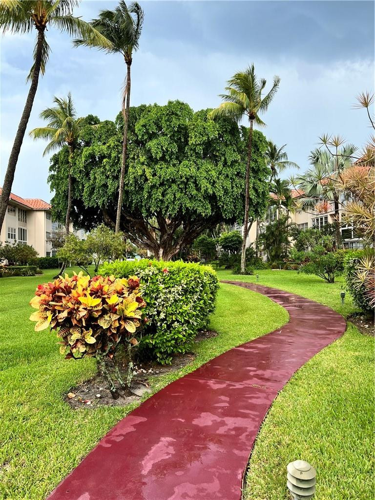 400 Northeast 20th Street, Unit B109 Boca Raton, FL 33431 - Photo 1 of 20 Walk way to the condo