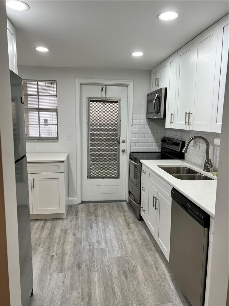 400 Northeast 20th Street, Unit B109 Boca Raton, FL 33431 - Photo 6 of 20 Additional kitchen door