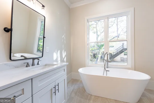 a bathroom with a double vanity sink mirror and double