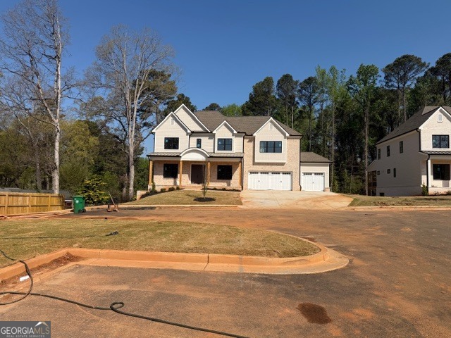 1976 Highgrove Court Atlanta, GA 30349 - Photo 12 of 48 a front view of a house with a yard and garage